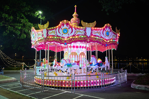 Illuminated classical carousel at night in Ipoh city, Malaysia