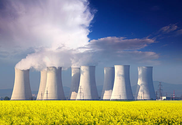 istock Nuclear Power plant with yellow field and blue sky 176993302