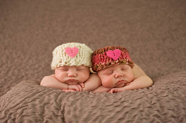 istock Sleeping Twin Newborn Girls 176993480