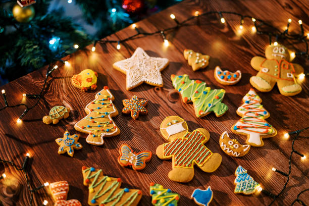 istock Glazed cookies lie on the table among luminous garlands. Top view 1769936786