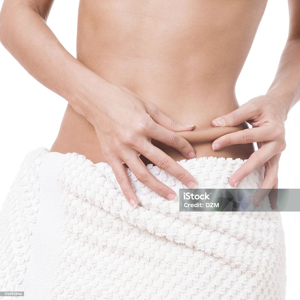 Lose weight Young woman is testing her belly skin One Woman Only Stock Photo