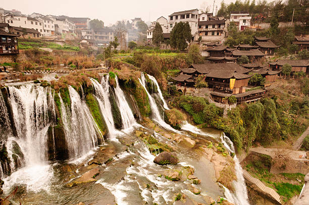 istock Houses and Waterfall, Furong Zhen (Hibiscus Town), China 176994002
