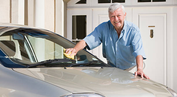 istock Senior man cleaning car 176994252