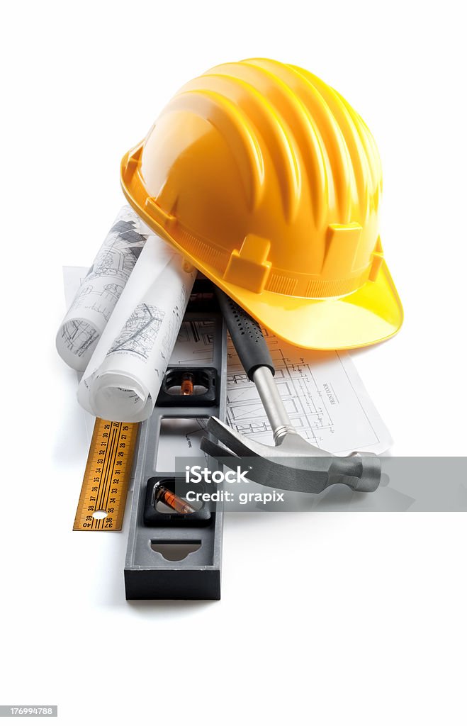 vertical constructor still life isolated hard hat with tools and blueprint on white Construction Equipment Stock Photo