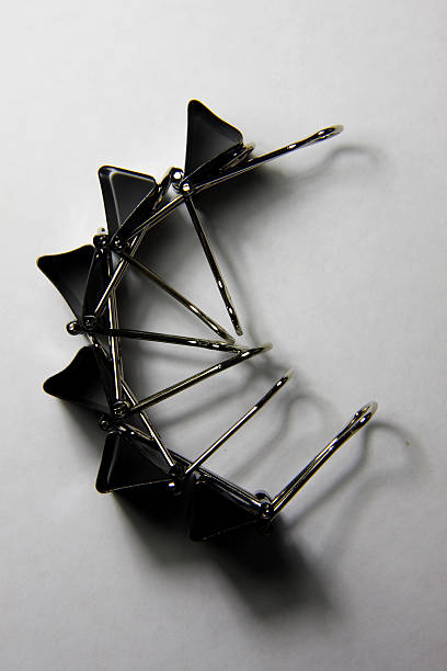 istock binder clip are clamping on white paper 176995041