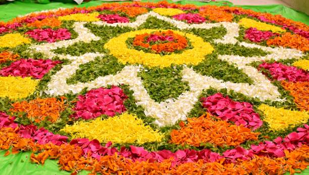 Pookalam with many flowers a Pookalam that's synonymous to Kerala and Onam pookalam stock pictures, royalty-free photos & images