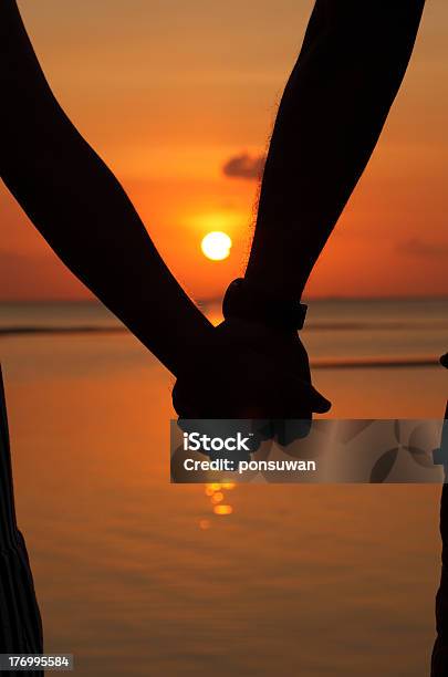 Silhouettes Couples Hands On Sunset Stock Photo - Download Image Now - Holding, In Silhouette, Love - Emotion