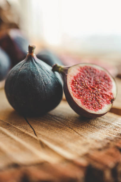 istock A few figs in a bowl on an old wooden background. 1769962861
