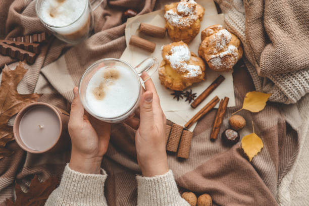 istock Cup of coffee in hands, cozy autumn 1769963382