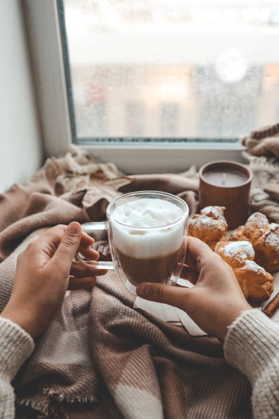 istock Cup of coffee in hands, cozy autumn 1769965100