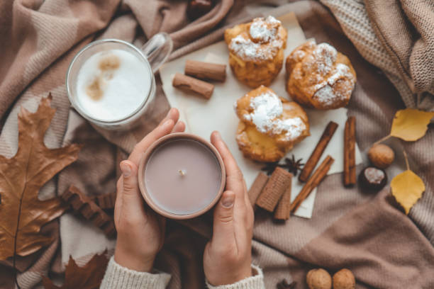 istock Cup of coffee in hands, cozy autumn 1769965111