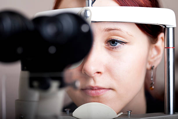 Woman having eye exam stock photo