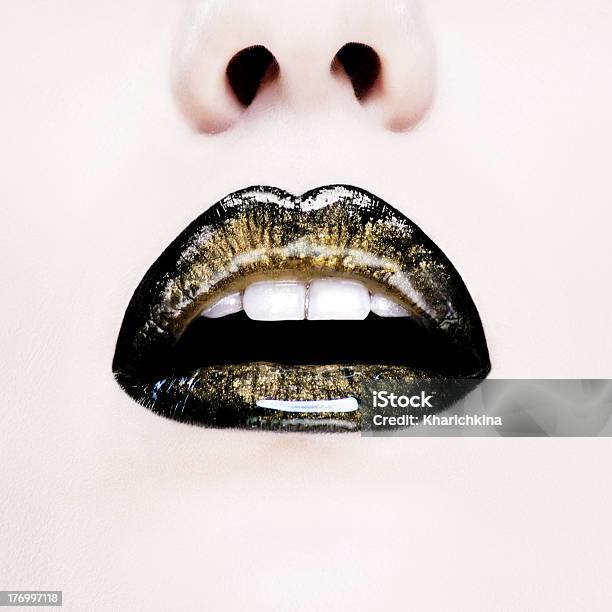 Close Up Of Female Lips In A Gloss Stock Photo - Download Image Now - Human Lips, Gold Colored, Black Color