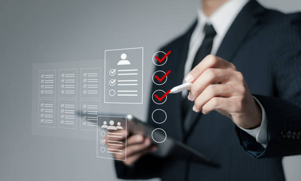 istock HR human resources  technology concept. Human resources manager reviews CVs to select personnel, Employment Headhunting, candidate, process of selecting people to work in the organization. 1769971601