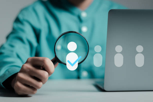 istock HR human resources  technology. Human resource manager uses magnifying glass with Hr icon to select personnel, Employment headhunting, candidate, process of selecting people to work in organization. 1769973162