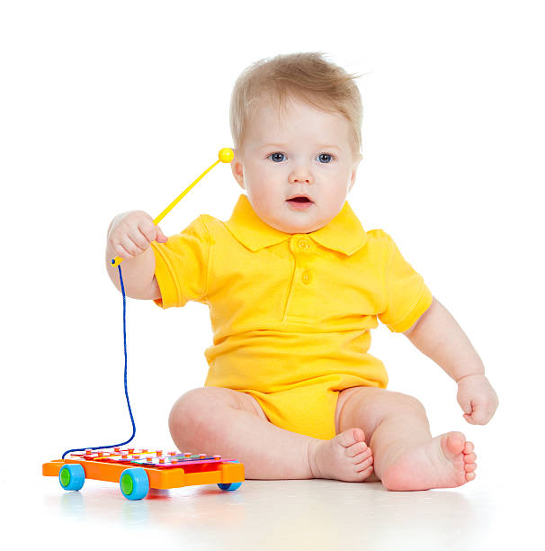 istock baby playing with musical toy 176997368