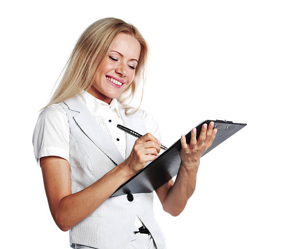 istock business woman writing in notebook 176997524
