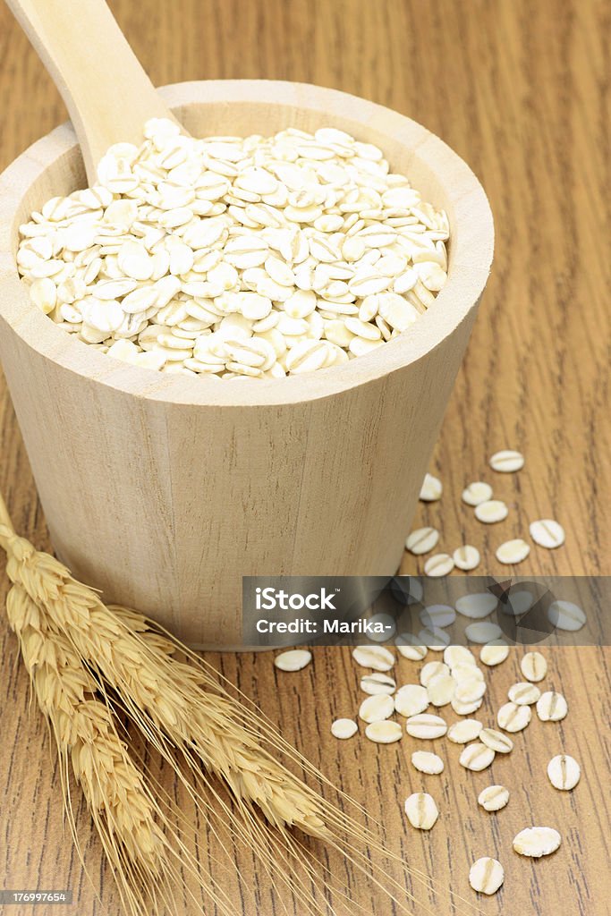 barley I put barley in a wooden container and attached a wheat ear and took it at a dining table. Barley Stock Photo