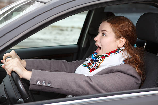 istock Pretty young woman sitting in car 176997748