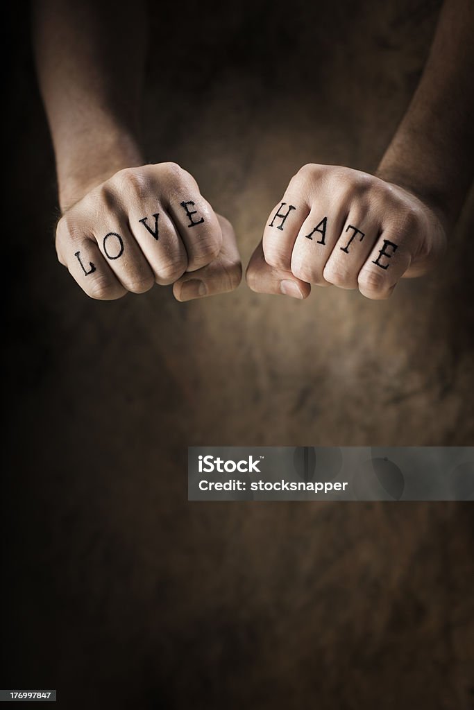 Love or Hate Man with Love and Hate (fake) tattoos. Tattoo Stock Photo