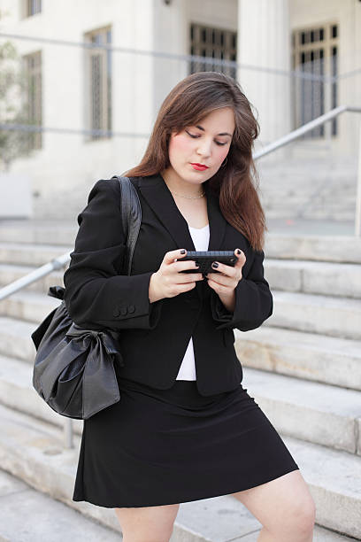 istock Woman texting on the phone 176998020