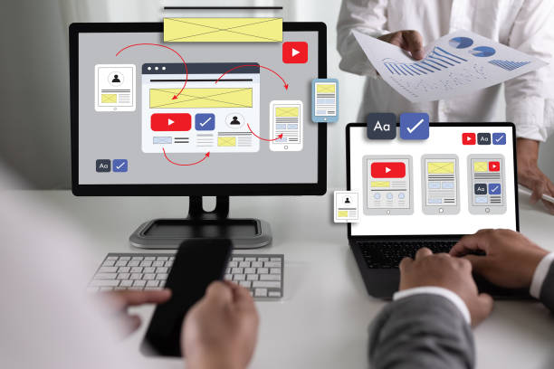 istock Team designers work on UI and UX designs for mobile app technology, digital interfaces, mobile screens, and mobile phone application design. 1769980578