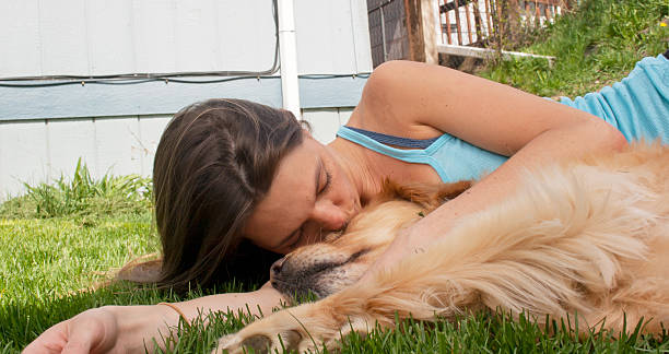 istock Young woman kissing dog 176998080