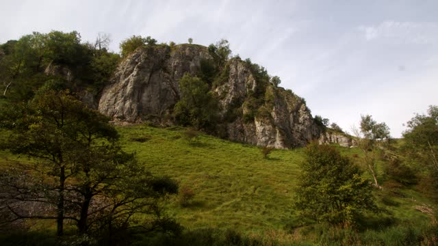 Wide shot looking back up the dovetail walk of a rocky outcrop of rocks, crag, rockface.