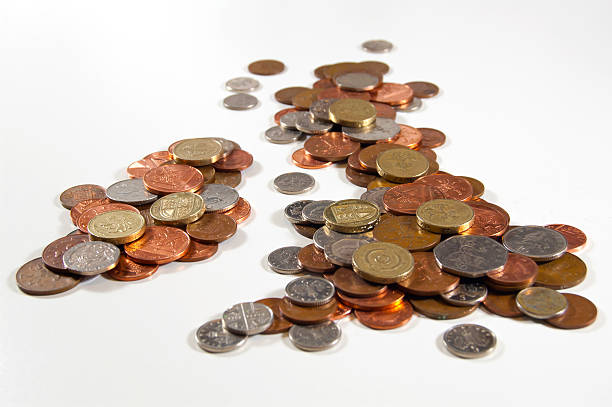 Money A collection of coins grouped to resemble UK & Ireland chancellor photos stock pictures, royalty-free photos & images