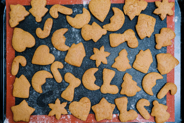 istock Freshly baked Christmas cookies lie on a baking sheet. Top view 1769995458