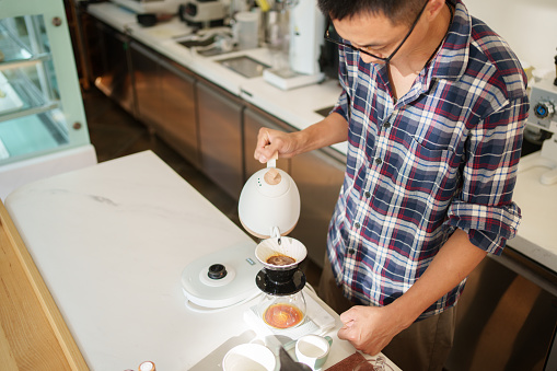 Barista making drip coffee