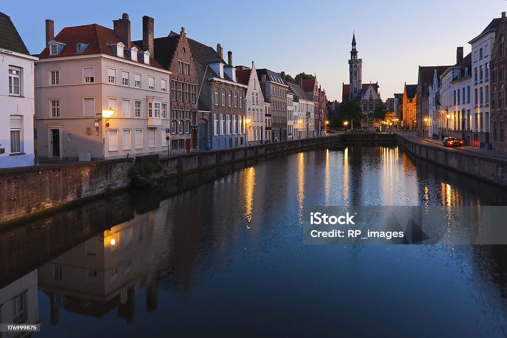 Night view of Brugge (Bruges) "Picturesque night view of the historical center of Brugge at sunset with its canals, old houses and bell towers" Architecture Stock Photo