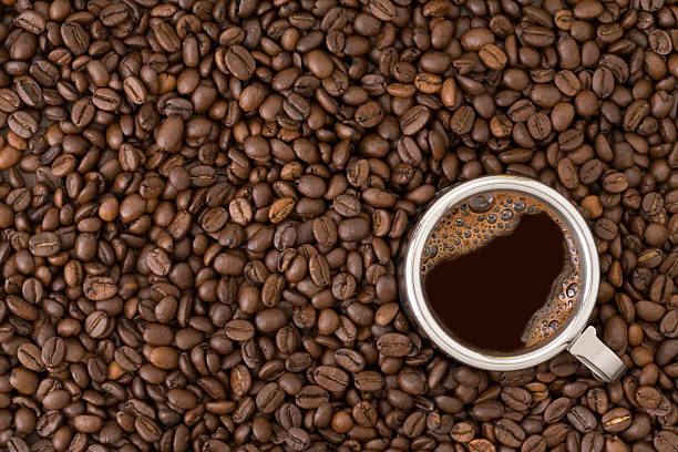 Coffee cup on beans background stock photo