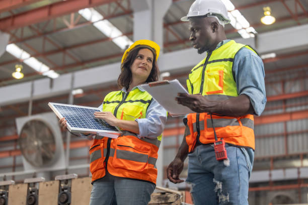 istock Factory metal workers install solar panels, cut costs, earn carbon credits, combat climate change. 1770013029