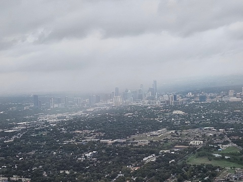 Arial view of downtown Austin Texas in a rainy day as landing in airport in November 2023