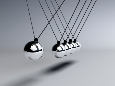 Conservation of energy is demonttrated with a Newtons Cradle in motion
