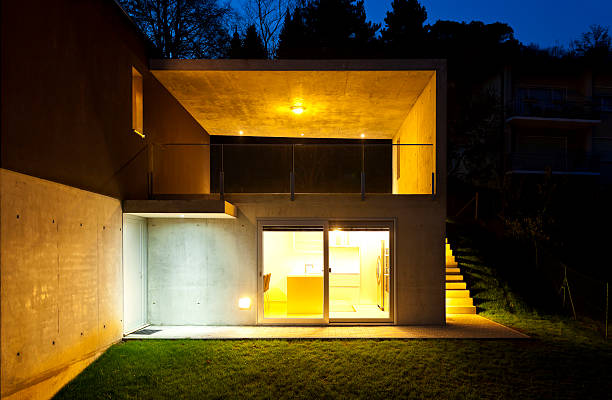 istock beautiful modern house by night 177002470