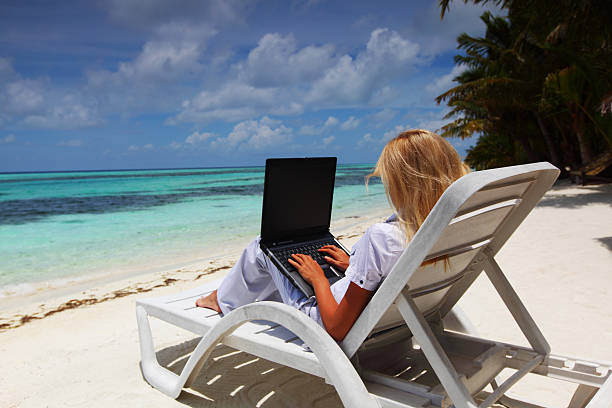 istock tropical business woman with laptop 177002811