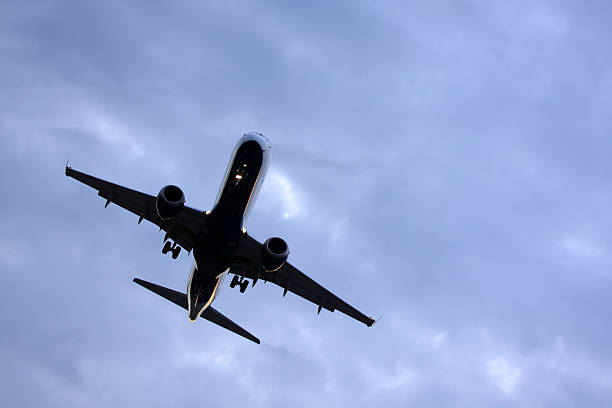 istock Silhouette of jet aircraft landing on a cloudy evening 177002972