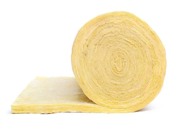 Photo of Close-up of roll of fibreglass insulation material on white