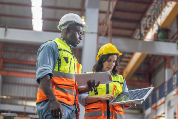 istock Factory metal workers install solar panels, cut costs, earn carbon credits, combat climate change. 1770030289