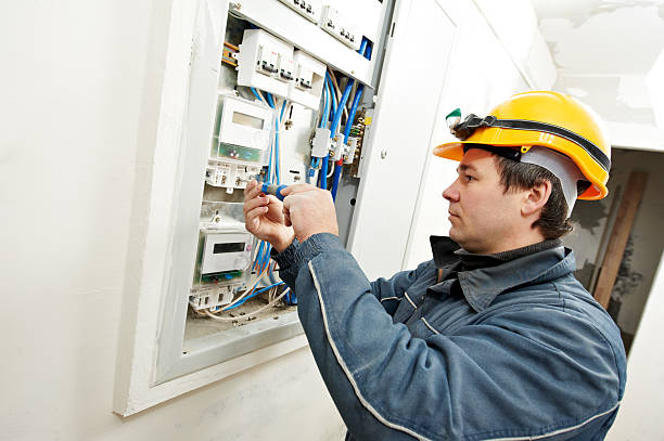 istock Electrician working on circuit board while wearing helmet 177003173