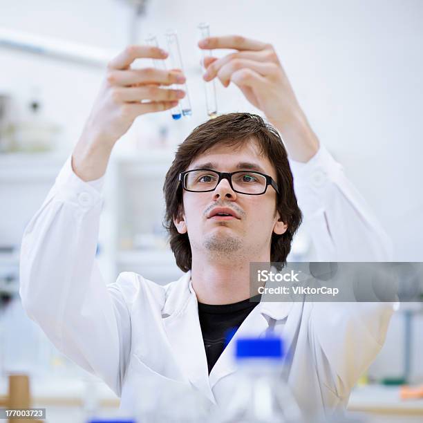 Young Male Researcher Carrying Out Scientific Research Stock Photo - Download Image Now