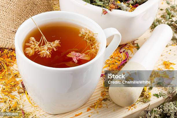 Cup Of Healthy Tea Mortar And Pestle With Healing Herbs Stock Photo - Download Image Now