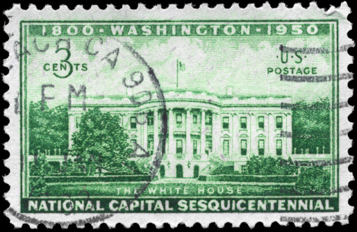 USA postage stamp isolated on black