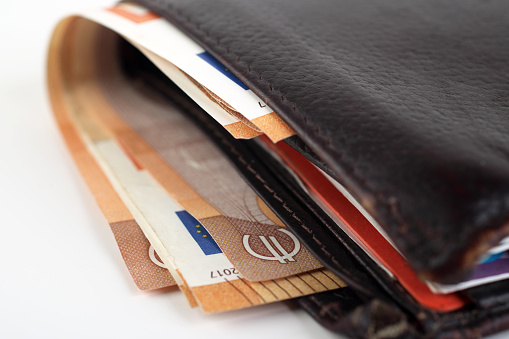 EUR banknotes in a leather wallet