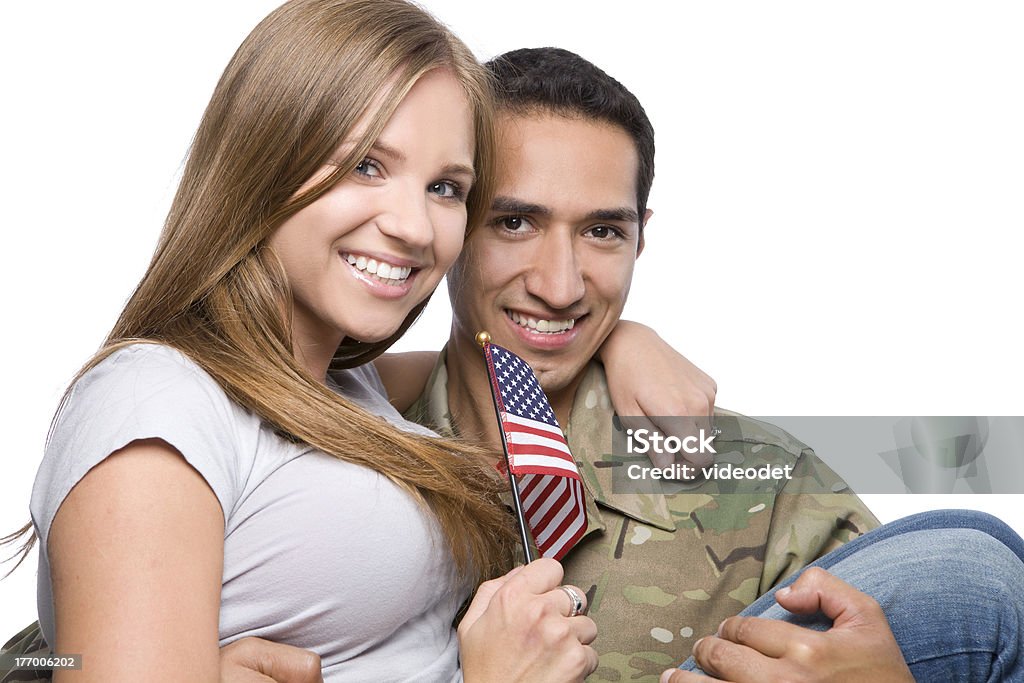 Wojsko człowiek posiada szczęśliwa żona w ramiona - Zbiór zdjęć royalty-free (Siły powietrzne)