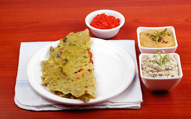 Karnataka cuisine rotti, chutney and chili sauce stock photo