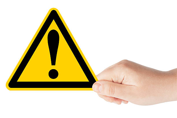 Danger And Hazard Sign in hand on the white background