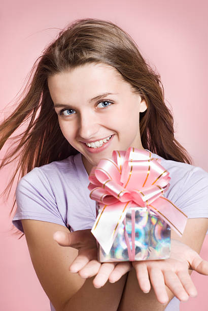 istock happy girl with a gift 177006998